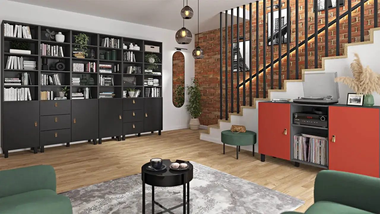 Nowoczesny salon z ceglaną ścianą i schodami. Czarna biblioteczka pełna książek i czerwona szafka z gramofonem.